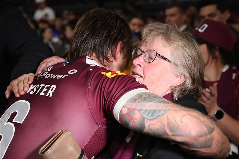 SYDNEY, AUSTRALIA - JULY 09: Cameron Munster of the Maroons and his mother Deborah embrace looks on during game three of the Men