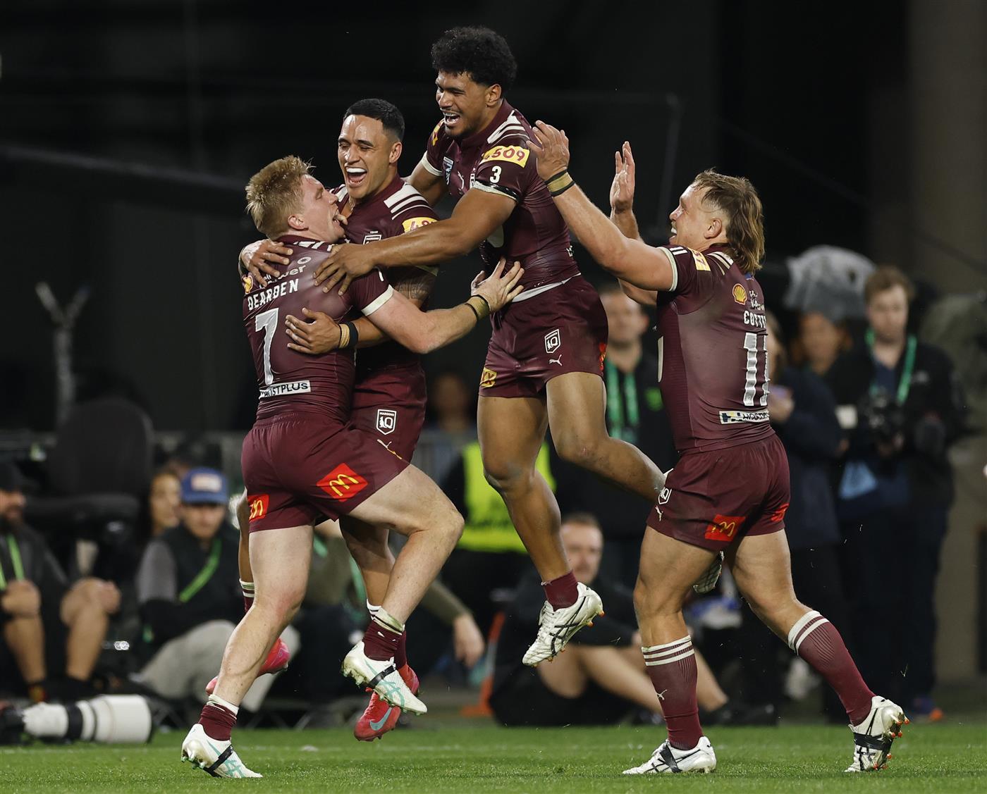 SYDNEY, AUSTRALIA - JULY 09: Tom Dearden of the Maroons celebrates scoring a try with teammates during game three of the Men
