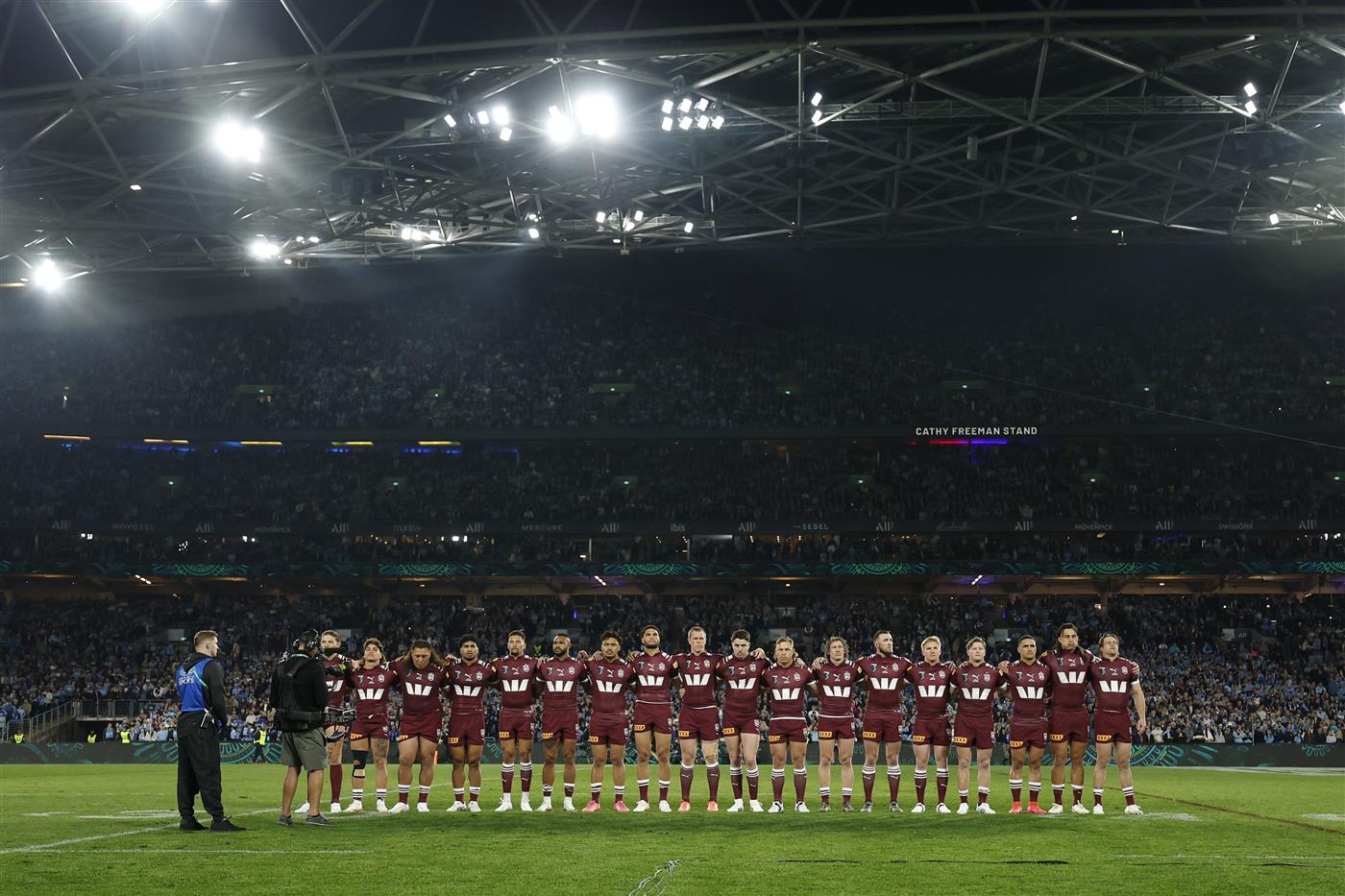 SYDNEY, AUSTRALIA - JULY 09: Queensland players line up for the national anthem ahead of game three of the Men