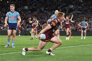 SYDNEY, AUSTRALIA - JULY 09: Tom Dearden of the Maroons celebrates a try during game three of the Men
