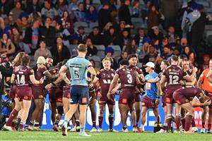 Maroons players celebrate their win in the final game three of the men