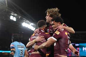SYDNEY, AUSTRALIA - JULY 09: Xavier Coates of the Maroons celebrates with Cameron Munster after scoring a try during game three of the Men