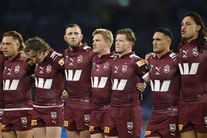 SYDNEY, AUSTRALIA - JULY 09: Kurt Capewell, Tom Dearden and Harry Grant of the Maroons line up for the national anthem ahead of game three of the Men