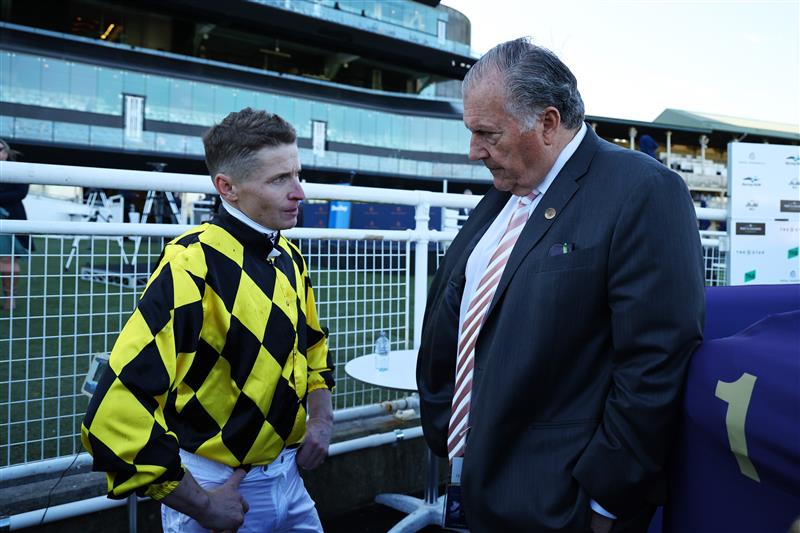 SYDNEY, AUSTRALIA - AUGUST 23: John Messara speaks with the jockey after James McDonald riding Autumn Glow win Race 7 Darley Toy Show Quality during Sydney Racing at Royal Randwick Racecourse on August 23, 2025 in Sydney, Australia. (Photo by Jeremy Ng/Getty Images)