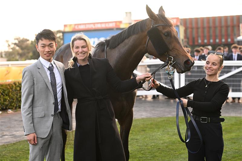 MELBOURNE, AUSTRALIA - AUGUST 30: Jun Zhang (Yulong) poses with Kate Laurie and Isabelle Eames after Treasurethe Moment won Race 9, the Stow Storage Memsie Stakes during Melbourne Racing at Caulfield Racecourse on August 30, 2025 in Melbourne, Australia. (Photo by Vince Caligiuri/Getty Images)