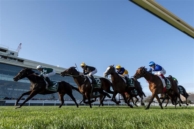 MELBOURNE, AUSTRALIA - AUGUST 30: Michael Dee riding Magic Time winning Race 8, the Evergreen Turf Cockram Stakes  during Melbourne Racing at Caulfield Racecourse on August 30, 2025 in Melbourne, Australia. (Photo by Vince Caligiuri/Getty Images)