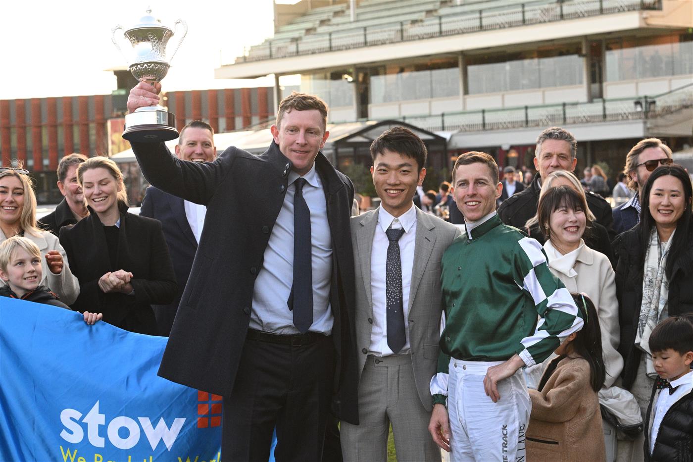 MELBOURNE, AUSTRALIA - AUGUST 30: Damian Lane poses with trainer Matt Laurie and Jun Zhang (Yulong) after riding Treasurethe Moment to win Race 9, the Stow Storage Memsie Stakes during Melbourne Racing at Caulfield Racecourse on August 30, 2025 in Melbourne, Australia. (Photo by Vince Caligiuri/Getty Images)