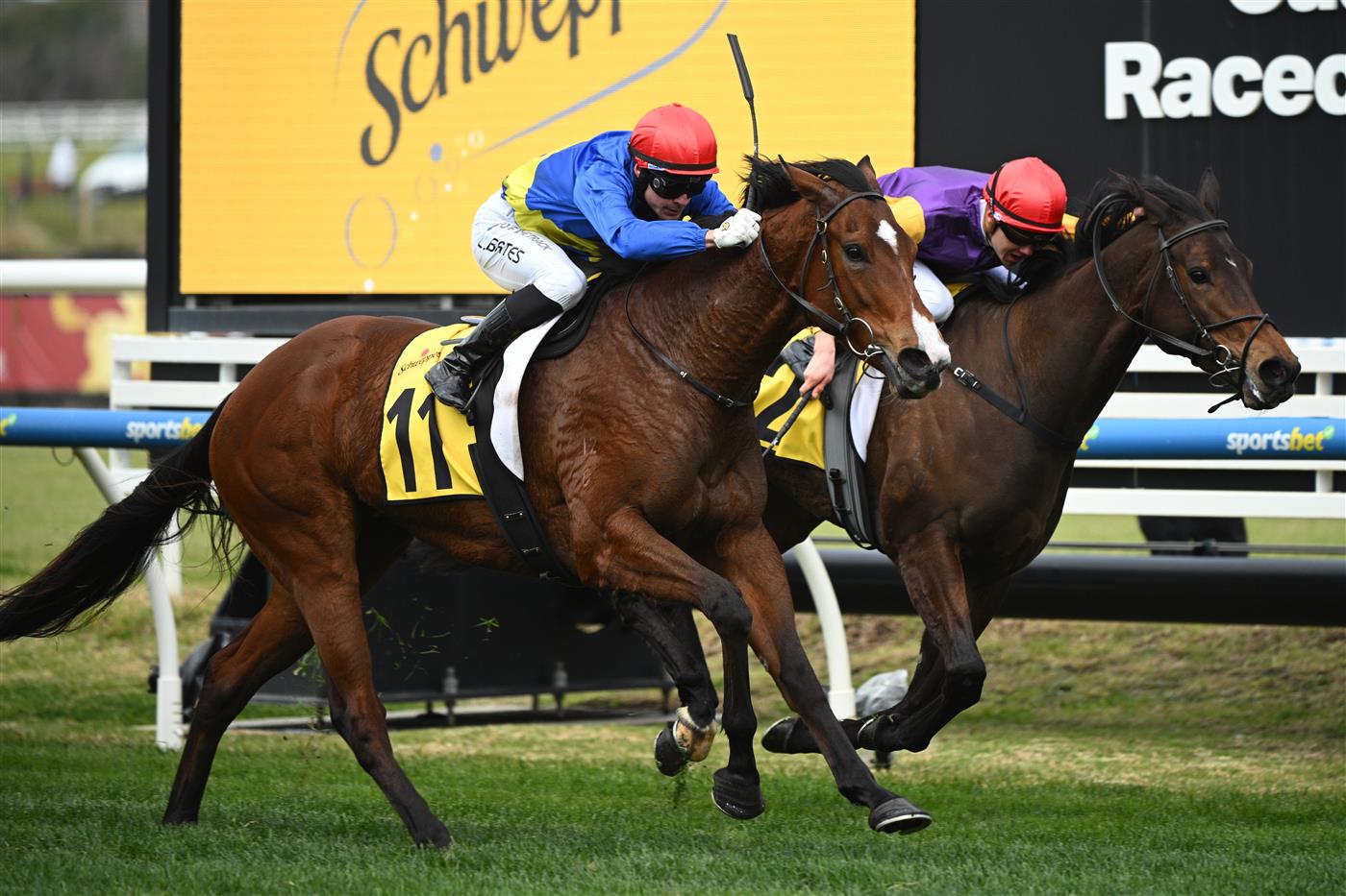 MELBOURNE, AUSTRALIA - AUGUST 30: Logan Bates riding Keep Your Cool defeats Tom Prebble riding Sassy Boom in Race 3, the Schweppes Handicap during Melbourne Racing at Caulfield Racecourse on August 30, 2025 in Melbourne, Australia. (Photo by Vince Caligiuri/Getty Images)