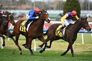 MELBOURNE, AUSTRALIA - AUGUST 30: Logan Bates riding Keep Your Cool defeats Tom Prebble riding Sassy Boom in Race 3, the Schweppes Handicap during Melbourne Racing at Caulfield Racecourse on August 30, 2025 in Melbourne, Australia. (Photo by Vince Caligiuri/Getty Images)