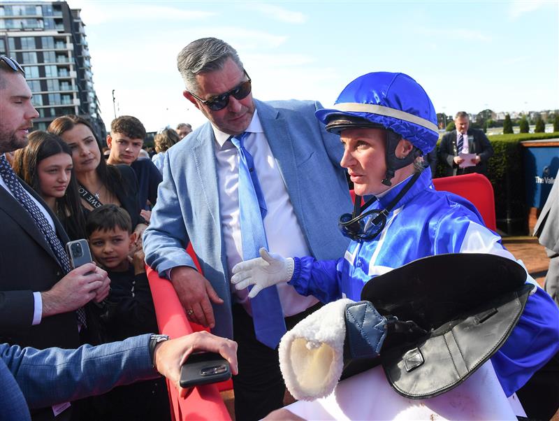 MELBOURNE, AUSTRALIA - SEPTEMBER 06: Jamie Melham speaks to connections and Trainer Clinton McDonald after riding Rosberg to win Race 6, the McMahon's McKenzie Stakes. (Getty)