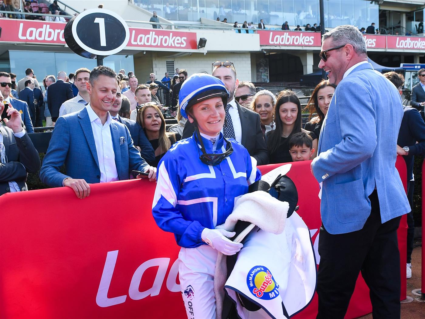 MELBOURNE, AUSTRALIA - SEPTEMBER 06: Jamie Melham speaks to connections and Trainer Clinton McDonald after riding Rosberg to win Race 6, the McMahon's McKenzie Stakes. (Getty)