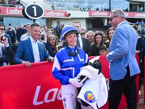 MELBOURNE, AUSTRALIA - SEPTEMBER 06: Jamie Melham speaks to connections and Trainer Clinton McDonald after riding Rosberg to win Race 6, the McMahon's McKenzie Stakes. (Getty)