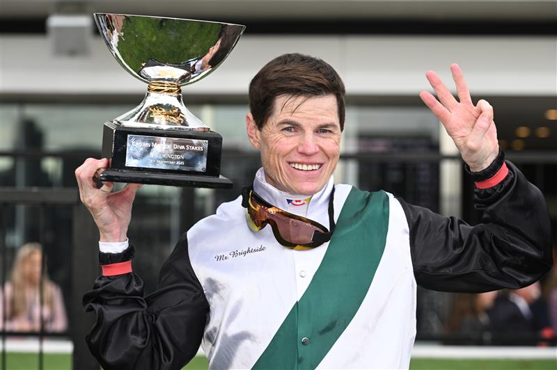 MELBOURNE, AUSTRALIA - SEPTEMBER 13: Craig Williams poses with trophy after riding Mr Brightside to win Race 8, the Crown Makybe Diva Stakes during Melbourne Racing at Flemington Racecourse on September 13, 2025 in Melbourne, Australia. (Photo by Vince Caligiuri/Getty Images)