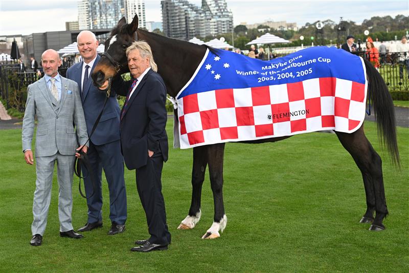MELBOURNE, AUSTRALIA - SEPTEMBER 13: Melbourne Cup winners, jockey Glen Boss, trainer David Hall and owner Tony Santic with champion mare Makybe Diva in the mounting yard before Race 8, the Crown Makybe Diva Stakes during Melbourne Racing at Flemington Racecourse on September 13, 2025 in Melbourne, Australia. (Photo by Vince Caligiuri/Getty Images)