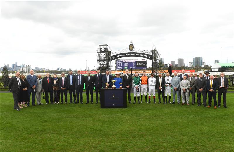 MELBOURNE, AUSTRALIA - SEPTEMBER 13: Neil Wilson, Chairman and Kylie Rogers (CEO) pose for a group photo after presenting Melbourne Cup winning trainers and jockeys with Life membership during Melbourne Racing at Flemington Racecourse on September 13, 2025 in Melbourne, Australia. (Photo by Vince Caligiuri/Getty Images)