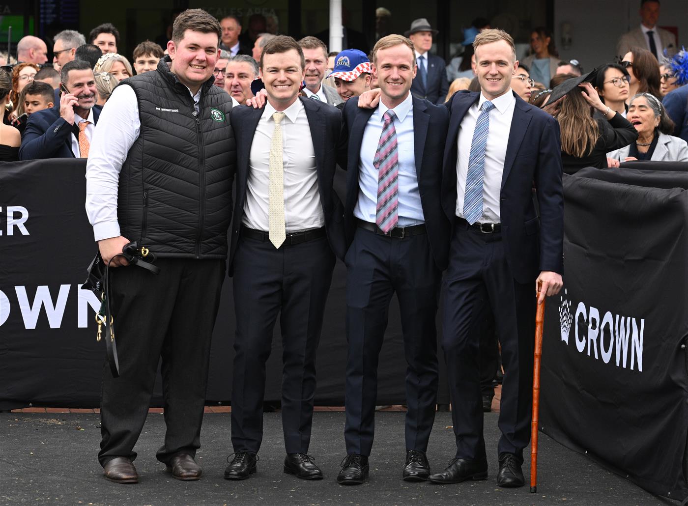 MELBOURNE, AUSTRALIA - SEPTEMBER 13: Strapper Will Evans poses with Co trainers Ben Hayes, JD Hayes and Will Hayes (r) after Mr Brightside won Race 8, the Crown Makybe Diva Stakes during Melbourne Racing at Flemington Racecourse on September 13, 2025 in Melbourne, Australia. (Photo by Vince Caligiuri/Getty Images)