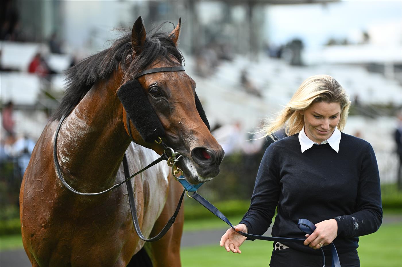 MELBOURNE, AUSTRALIA - SEPTEMBER 13: Kate Brideoake poses with Vinrock after winning Race 3, the Rubaroc Exford Plate during Melbourne Racing at Flemington Racecourse on September 13, 2025 in Melbourne, Australia. (Photo by Vince Caligiuri/Getty Images)