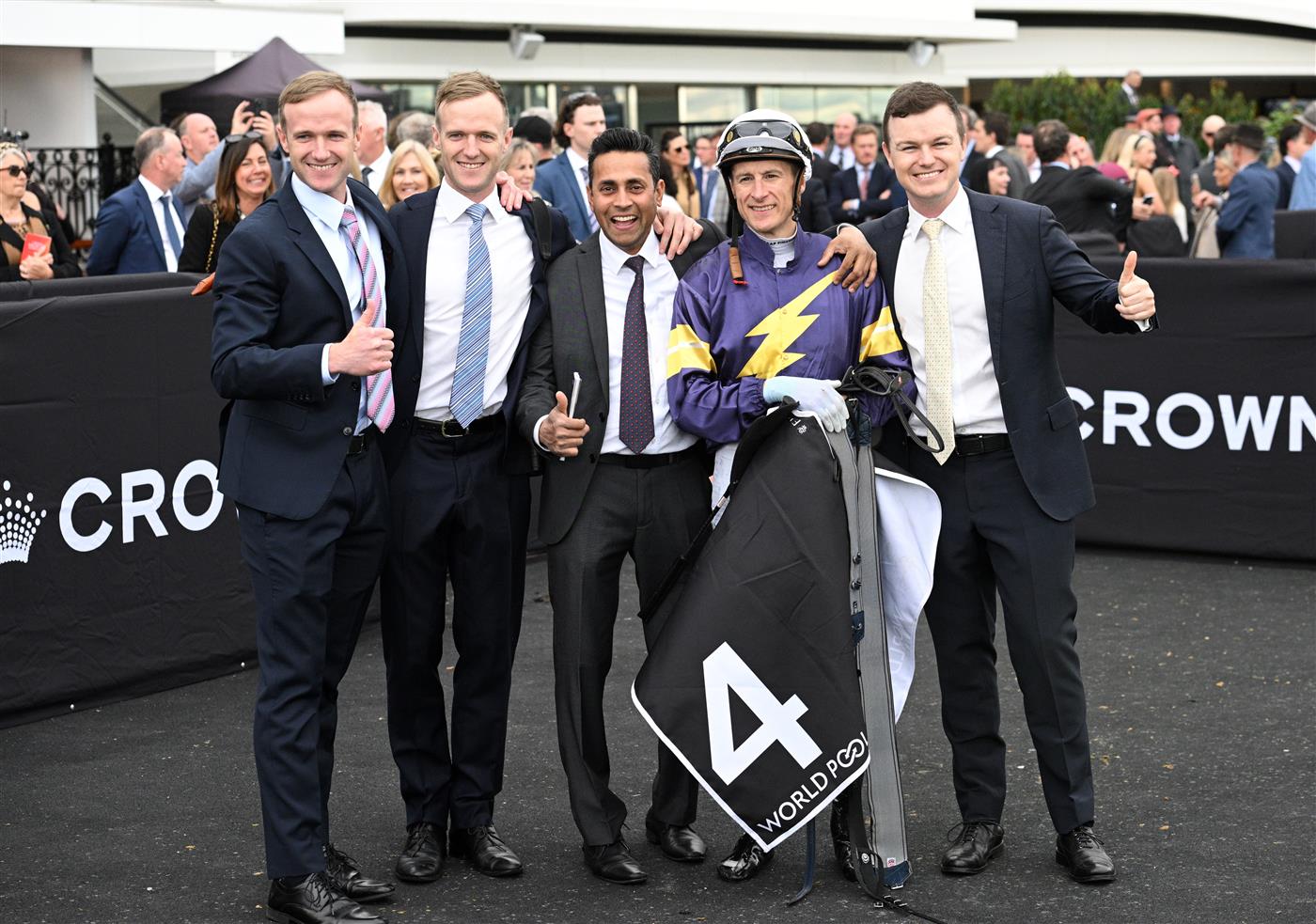MELBOURNE, AUSTRALIA - SEPTEMBER 13: Blake Shinn poses with The Hayes team after riding Arkansaw Kid to win Race 6, the Hkjc World Pool Bobbie Lewis Quality during Melbourne Racing at Flemington Racecourse on September 13, 2025 in Melbourne, Australia. (Photo by Vince Caligiuri/Getty Images)
