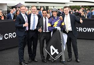 MELBOURNE, AUSTRALIA - SEPTEMBER 13: Blake Shinn poses with The Hayes team after riding Arkansaw Kid to win Race 6, the Hkjc World Pool Bobbie Lewis Quality during Melbourne Racing at Flemington Racecourse on September 13, 2025 in Melbourne, Australia. (Photo by Vince Caligiuri/Getty Images)