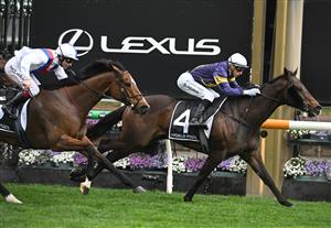 MELBOURNE, AUSTRALIA - SEPTEMBER 13: Blake Shinn riding Arkansaw Kid defeats Star Patrol in Race 6, the Hkjc World Pool Bobbie Lewis Quality during Melbourne Racing at Flemington Racecourse on September 13, 2025 in Melbourne, Australia. (Photo by Vince Caligiuri/Getty Images)