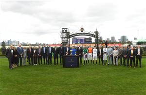 MELBOURNE, AUSTRALIA - SEPTEMBER 13: Neil Wilson, Chairman and Kylie Rogers (CEO) pose for a group photo after presenting Melbourne Cup winning trainers and jockeys with Life membership during Melbourne Racing at Flemington Racecourse on September 13, 2025 in Melbourne, Australia. (Photo by Vince Caligiuri/Getty Images)