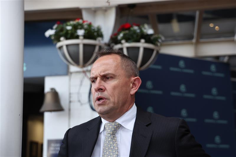 SYDNEY, AUSTRALIA - SEPTEMBER 27: Trainer Chris Waller looks on James McDonald riding Waterford  win Race 9 Canadian Club Shannon Stakes during Sydney Racing at Rosehill Gardens on September 27, 2025 in Sydney, Australia. (Photo by Jeremy Ng/Getty Images)
