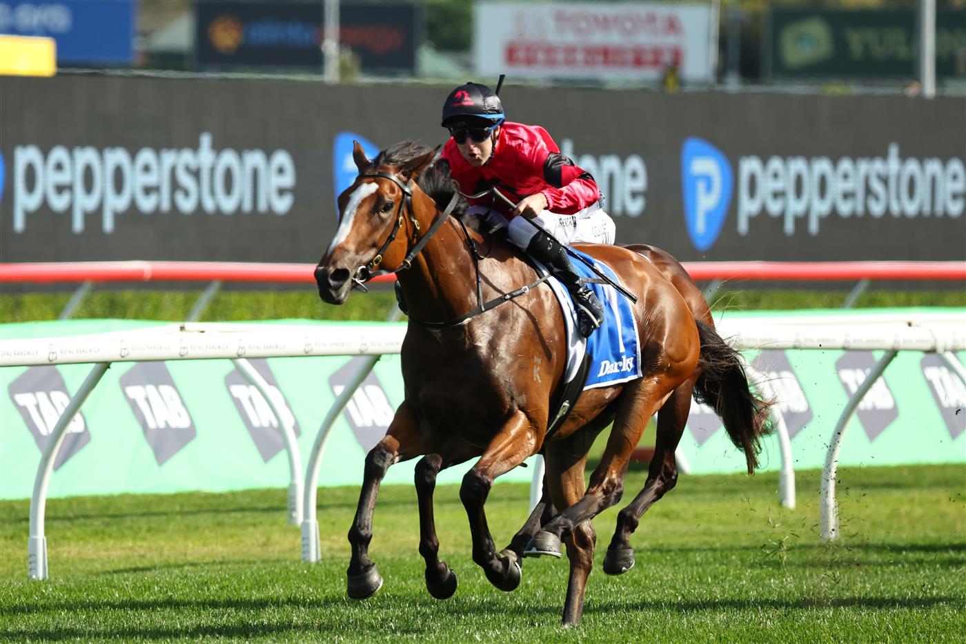 SYDNEY, AUSTRALIA - OCTOBER 04: Tommy Berry riding Apocalyptic  win Race 6 Darley Flight Stakes during Sydney Racing at Royal Randwick Racecourse on October 04, 2025 in Sydney, Australia. (Photo by Jeremy Ng/Getty Images)