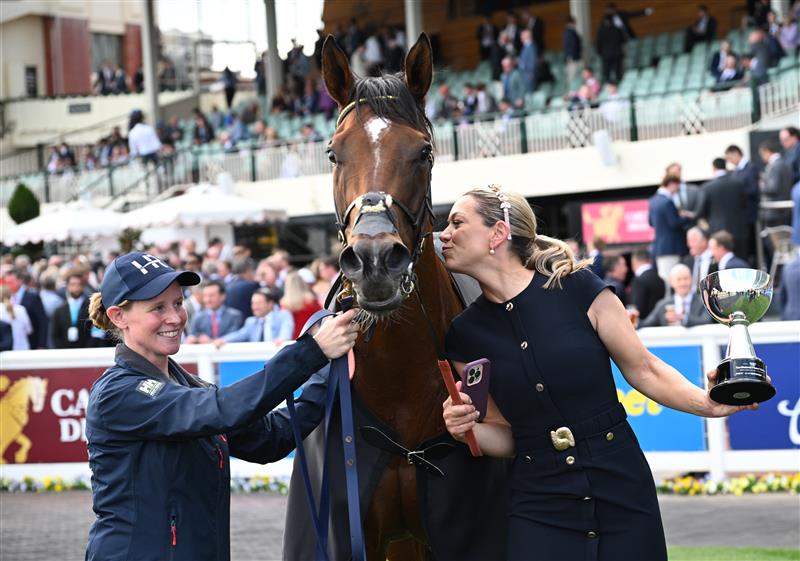 MELBOURNE, AUSTRALIA - OCTOBER 11: Trainer Charlotte Littlefield hugs She's Bulletproof after winning Race 10, the Northwood Plume Stakes. (Getty)