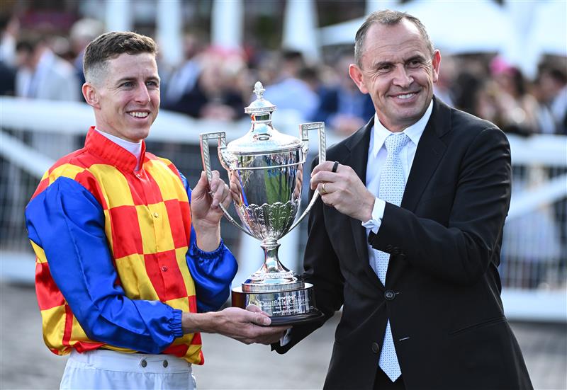 MELBOURNE, AUSTRALIA - OCTOBER 11: Damian Lane poses with Trainer Chris Waller after riding Autumn Boy to win Race 8, the Sportsbet Caulfield Guineas during Melbourne Racing at Caulfield Racecourse on October 11, 2025 in Melbourne, Australia. (Photo by Vince Caligiuri/Getty Images)