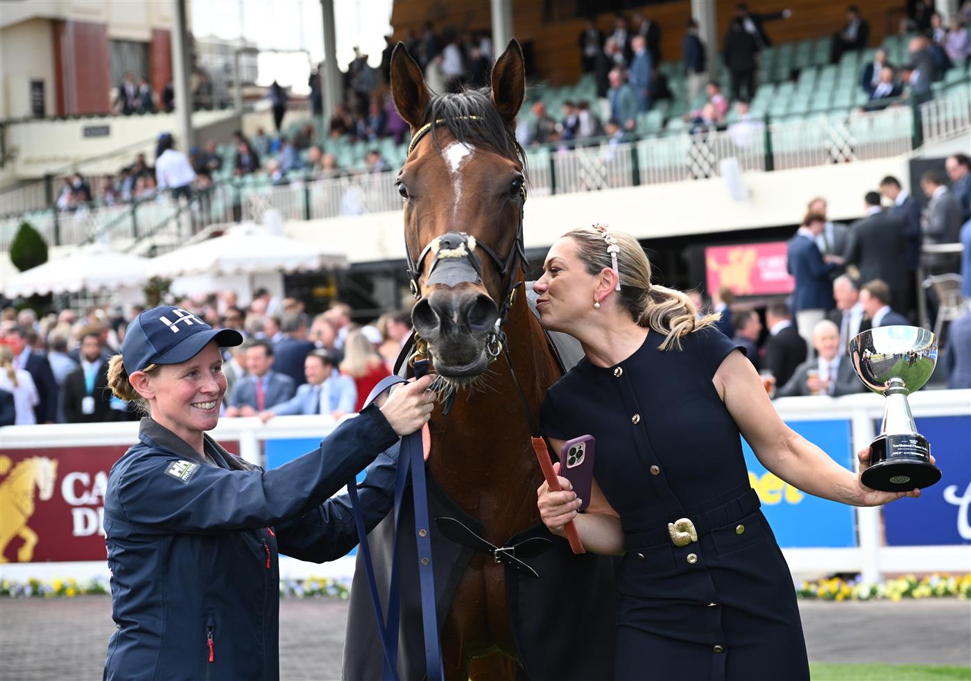 MELBOURNE, AUSTRALIA - OCTOBER 11: Trainer Charlotte Littlefield hugs She's Bulletproof after winning Race 10, the Northwood Plume Stakes. (Getty)