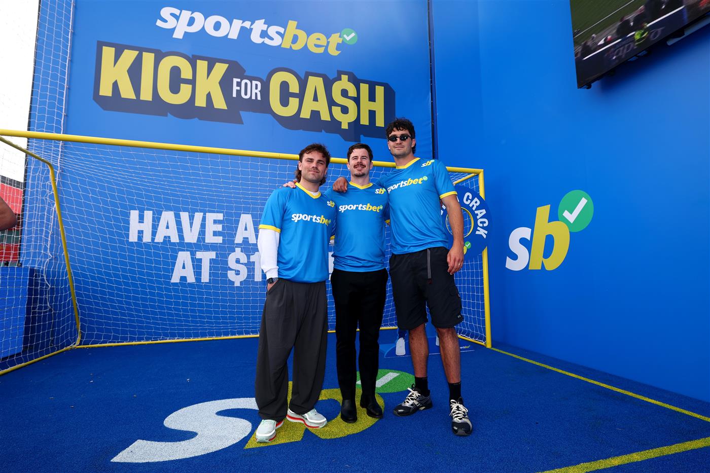 MELBOURNE, AUSTRALIA - OCTOBER 11: Nick Watson of the Hawks, Jack Higgins of the Saints and Tom Barrass of the Hawks pose during the Sportsbet Kick for Cash event at Caulfield Racecourse, celebrating the 20th anniversary of John Aloisi kicking the winning penalty that qualified Australia for the 2006 World Cup. (Getty)