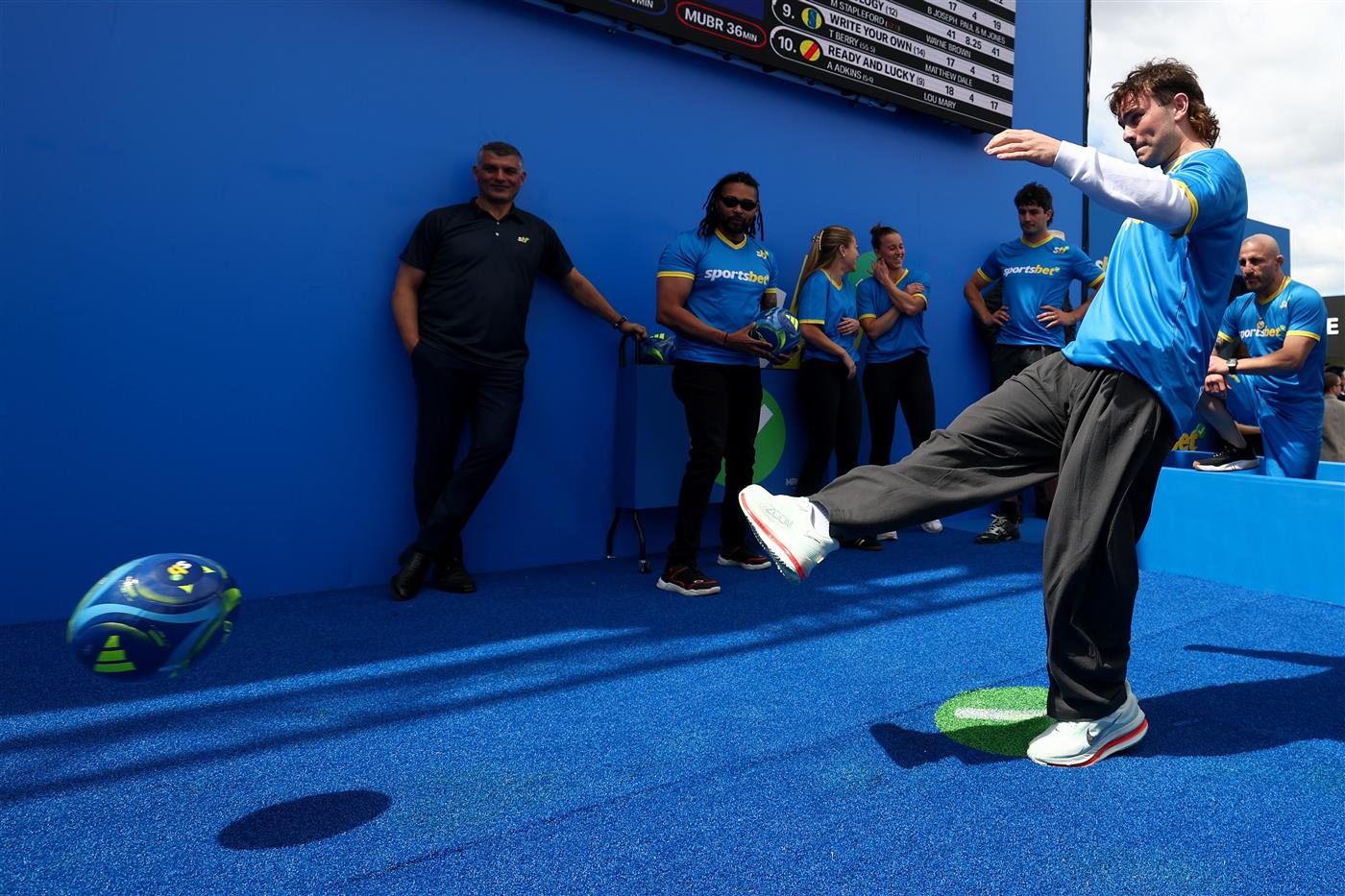 MELBOURNE, AUSTRALIA - OCTOBER 11: Nick Watson of the Hawks kicks for cash during the Sportsbet Kick for Cash event at Caulfield Racecourse, celebrating the 20th anniversary of celebrating the 20th anniversary of John Aloisi kicking the winning penalty that qualified Australia for the 2006 World Cup. (Getty)