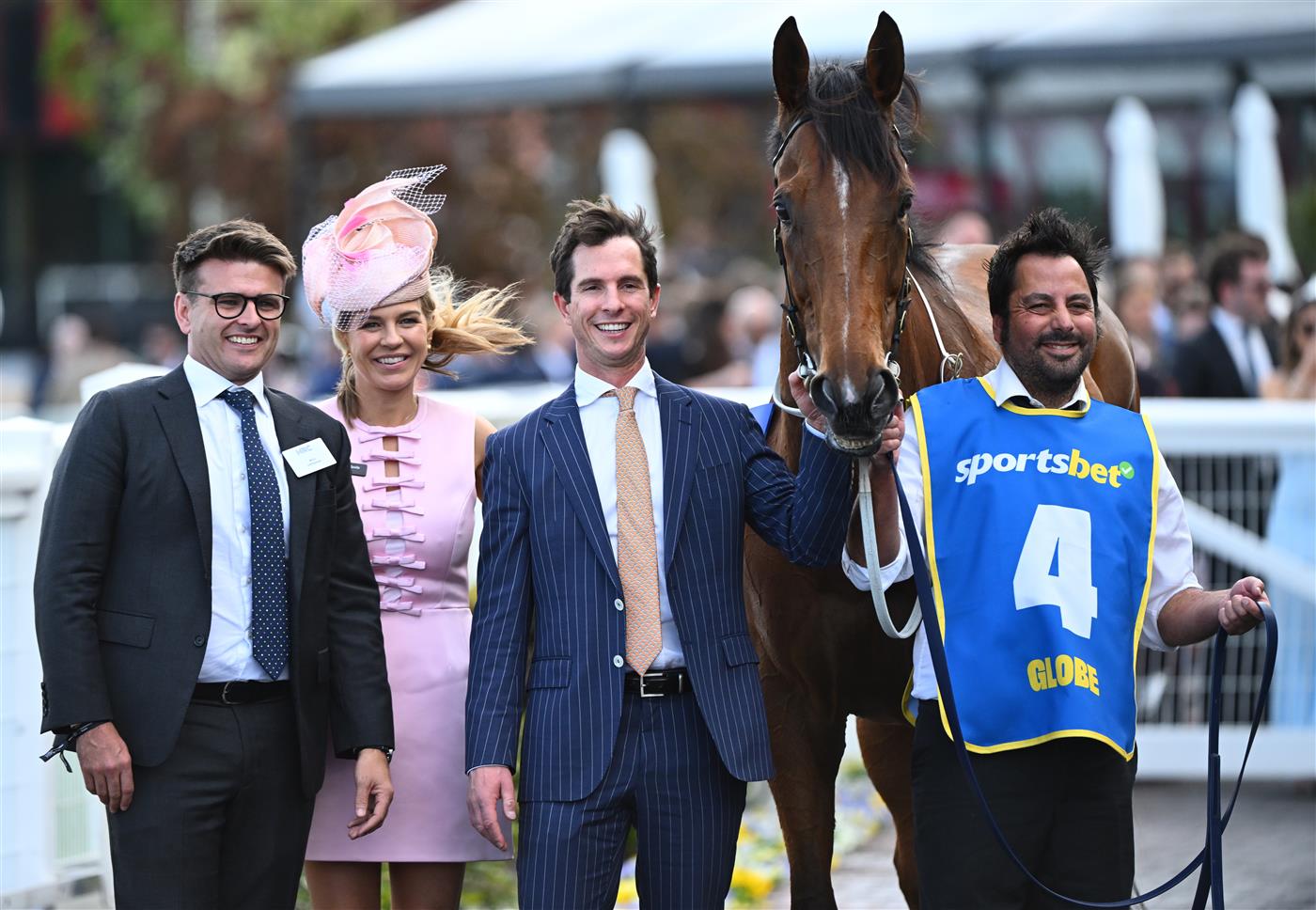 MELBOURNE, AUSTRALIA - OCTOBER 11: Globe poses with trainer Michael Kent Jnr after winning Race 6, the Sportsbet Might And Power during Melbourne Racing at Caulfield Racecourse on October 11, 2025 in Melbourne, Australia. (Photo by Vince Caligiuri/Getty Images)