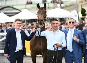 MELBOURNE, AUSTRALIA - OCTOBER 11: Trainer Tony Gollan (r) poses after Transatlantic won Race 7, the Hyland Race Colours Toorak Handicap during Melbourne Racing at Caulfield Racecourse on October 11, 2025 in Melbourne, Australia. (Photo by Vince Caligiuri/Getty Images)