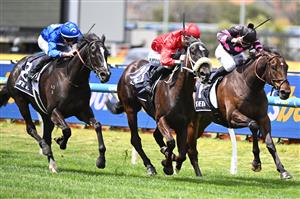 MELBOURNE, AUSTRALIA - OCTOBER 11: Zac Spain riding Blindedbythelight defeats Al Duca (r) and Nearing Liberty (L) in Race 1, the Sen Handicap during Melbourne Racing at Caulfield Racecourse on October 11, 2025 in Melbourne, Australia. (Photo by Vince Caligiuri/Getty Images)
