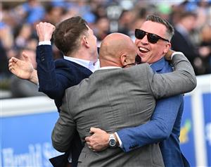 MELBOURNE, AUSTRALIA - OCTOBER 11: Trainer Tony Gollan (r) reacts after Transatlantic won Race 7, the Hyland Race Colours Toorak Handicap during Melbourne Racing at Caulfield Racecourse on October 11, 2025 in Melbourne, Australia. (Photo by Vince Caligiuri/Getty Images)