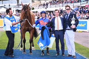 MELBOURNE, AUSTRALIA - OCTOBER 11: Blake Shinn riding Globe poses with Trainer Michael Kent Jnr after winning Race 6, the Sportsbet Might And Power during Melbourne Racing at Caulfield Racecourse on October 11, 2025 in Melbourne, Australia. (Photo by Vince Caligiuri/Getty Images)