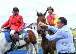 MELBOURNE, AUSTRALIA - OCTOBER 11: Damian Lane riding Oh Too Good and trainer Kevin Daffy after winning Race 4, the Catanach's Jewellers Vase. (Getty)
