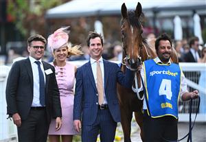 MELBOURNE, AUSTRALIA - OCTOBER 11: Globe poses with trainer Michael Kent Jnr after winning Race 6, the Sportsbet Might And Power during Melbourne Racing at Caulfield Racecourse on October 11, 2025 in Melbourne, Australia. (Photo by Vince Caligiuri/Getty Images)