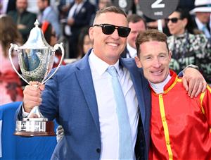 MELBOURNE, AUSTRALIA - OCTOBER 11: Trainer Tony Gollan poses with Mark Zahra after Transatlantic won Race 7, the Hyland Race Colours Toorak Handicap during Melbourne Racing at Caulfield Racecourse on October 11, 2025 in Melbourne, Australia. (Photo by Vince Caligiuri/Getty Images)
