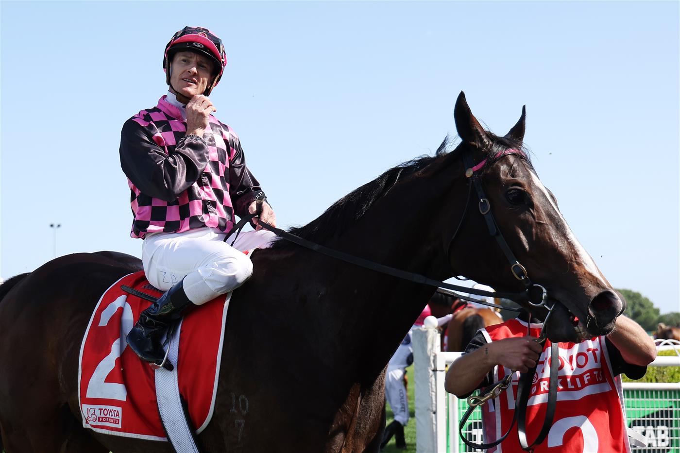 SYDNEY, AUSTRALIA - OCTOBER 18: Zac Purton riding Rothfire  win Race 6 Toyota Forklifts Sydney Stakes during Sydney Racing at Royal Randwick Racecourse on October 18, 2025 in Sydney, Australia. (Photo by Jeremy Ng/Getty Images)