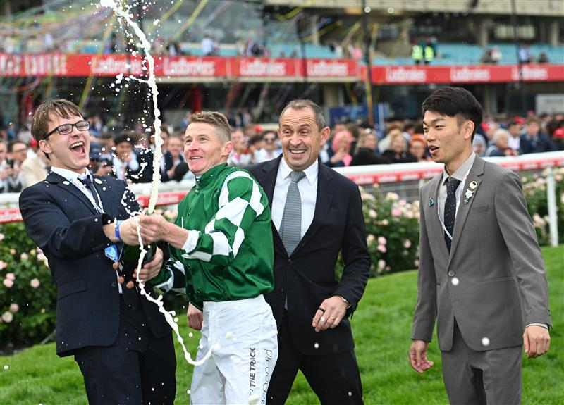 MELBOURNE, AUSTRALIA - OCTOBER 25: James McDonald sprays champagne after riding Via Sistina to win Race 10 , the Ladbrokes Cox Plate during Cox Plate Day at Moonee Valley Racecourse on October 25, 2025 in Melbourne, Australia. (Photo by Vince Caligiuri/Getty Images)