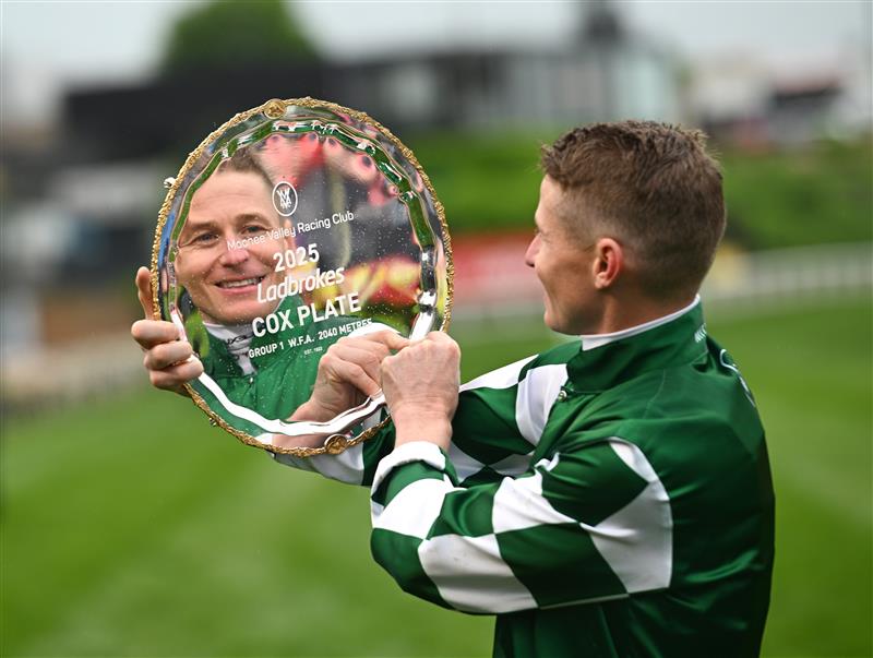 MELBOURNE, AUSTRALIA - OCTOBER 25: James McDonald poses with the Cox Plate after riding Via Sistina to win Race 10 , the Ladbrokes Cox Plate during Cox Plate Day at Moonee Valley Racecourse on October 25, 2025 in Melbourne, Australia. (Photo by Vince Caligiuri/Getty Images)