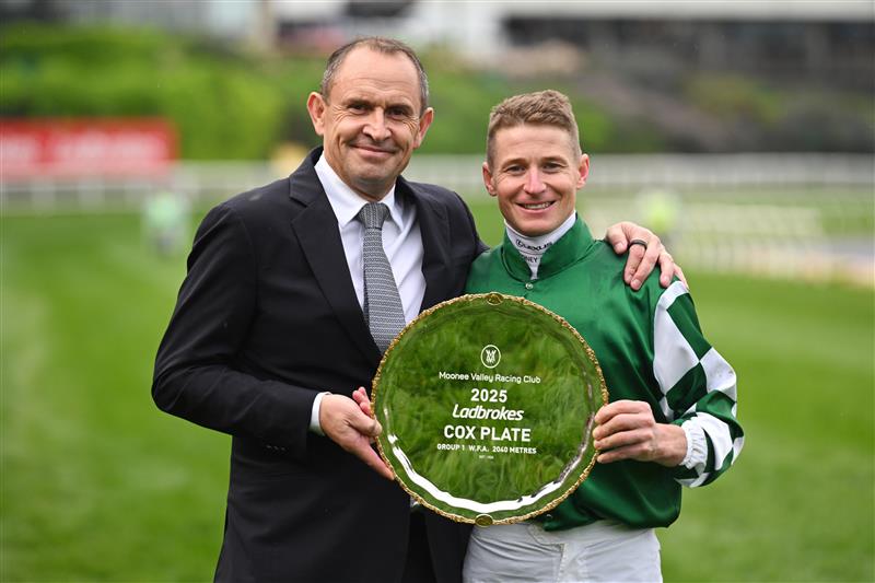 MELBOURNE, AUSTRALIA - OCTOBER 25: James McDonald and Trainer Chris Waller pose with the Cox Plate after riding Via Sistina to win Race 10 , the Ladbrokes Cox Plate during Cox Plate Day at Moonee Valley Racecourse on October 25, 2025 in Melbourne, Australia. (Photo by Vince Caligiuri/Getty Images)