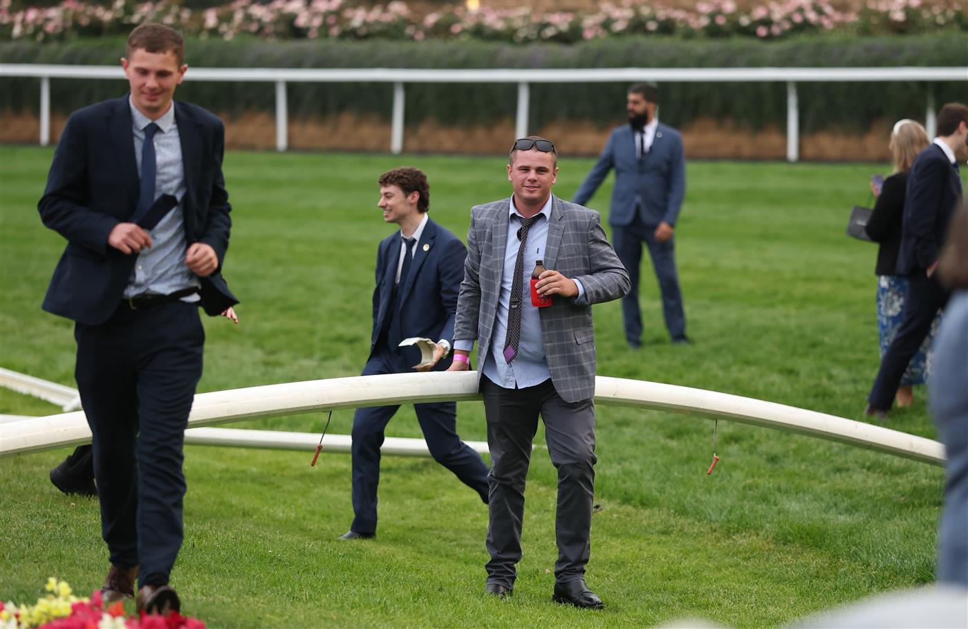 MELBOURNE, AUSTRALIA - OCTOBER 25: Spectators are seen on the track after the Cox Plate Day at Moonee Valley Racecourse on October 25, 2025 in Melbourne, Australia. (Photo by Robert Cianflone/Getty Images)