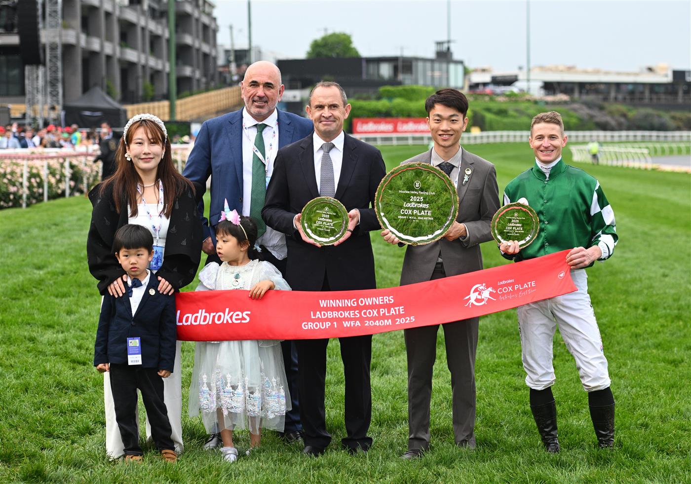 MELBOURNE, AUSTRALIA - OCTOBER 25: James McDonald poses with trainer Chris Waller, Sam Fairgray and owner Jun Zhang representing Yulong after Via Sistina won Race 10 , the Ladbrokes Cox Plate during Cox Plate Day at Moonee Valley Racecourse on October 25, 2025 in Melbourne, Australia. (Photo by Vince Caligiuri/Getty Images)