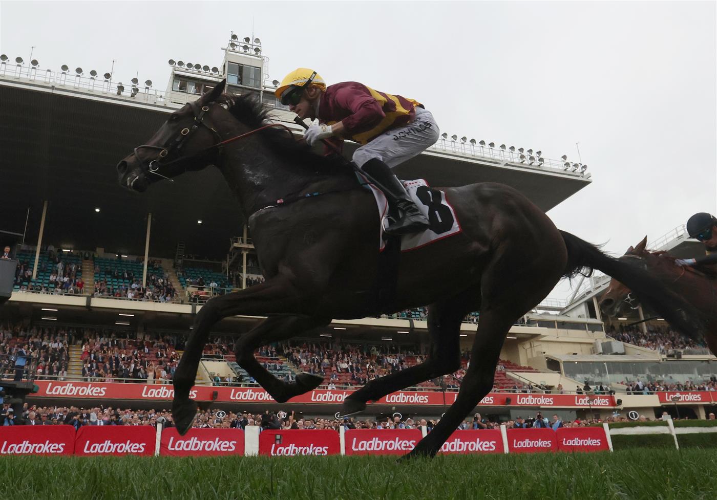 MELBOURNE, AUSTRALIA - OCTOBER 25: Jordan Childs rides #8 She's A Hustler to win the Tesio Stakes. (Getty)