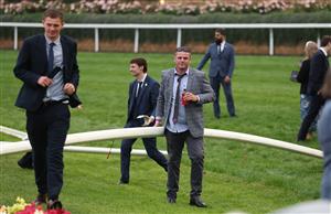 MELBOURNE, AUSTRALIA - OCTOBER 25: Spectators are seen on the track after the Cox Plate Day at Moonee Valley Racecourse on October 25, 2025 in Melbourne, Australia. (Photo by Robert Cianflone/Getty Images)