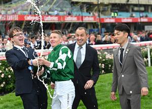 MELBOURNE, AUSTRALIA - OCTOBER 25: James McDonald sprays champagne after riding Via Sistina to win Race 10 , the Ladbrokes Cox Plate during Cox Plate Day at Moonee Valley Racecourse on October 25, 2025 in Melbourne, Australia. (Photo by Vince Caligiuri/Getty Images)