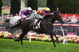 MELBOURNE, AUSTRALIA - OCTOBER 25: Jordan Childs rides #8 She's A Hustler to win the Tesio Stakes. (Getty)
